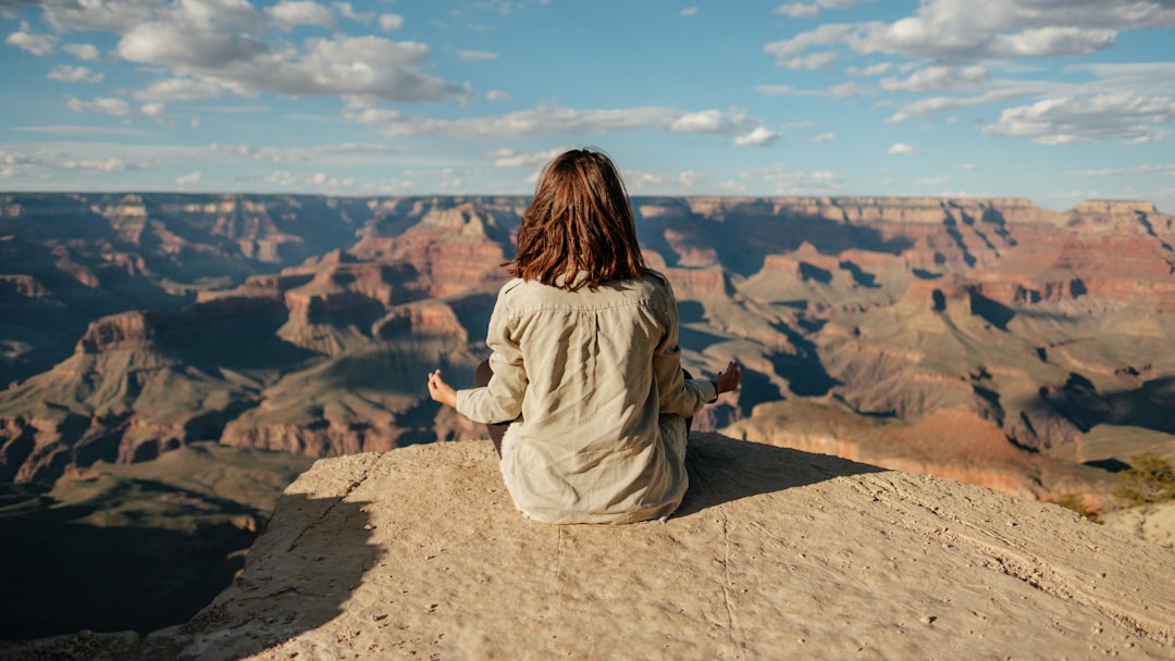 woman-sitting-on-hill-vd-vjc8vmra